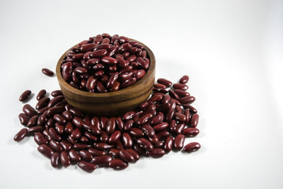 Close-up of coffee beans against white background