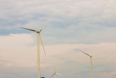 Low angle view of wind turbine against sky