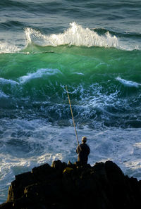 Man fishing in sea