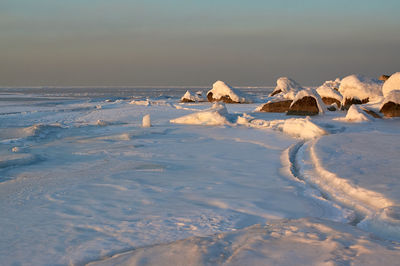 Scenic view of sea against sky during winter