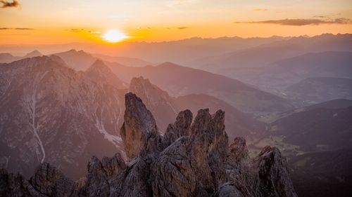 Panoramic view of mountains against sky during sunset