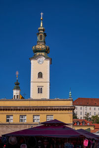Low angle view of building against clear blue sky