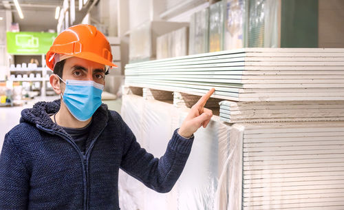 Portrait of young man wearing protective mask