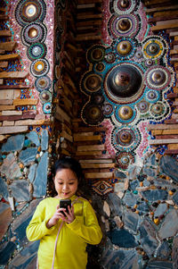 Portrait of woman standing at temple