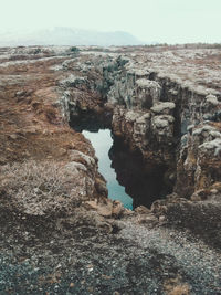 Idyllic shot of rock formation against sky