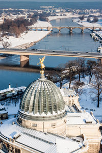 Academy of fine arts dresden against river during winter