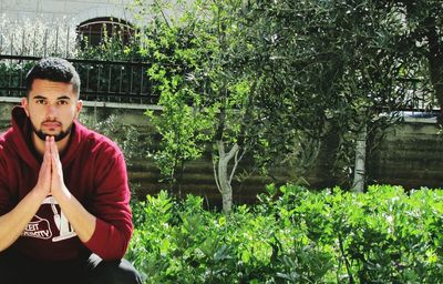 Portrait of man against plants