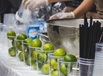 View of limes and cups on table