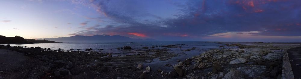 Scenic view of sea against cloudy sky