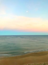 Scenic view of sea against sky at sunset