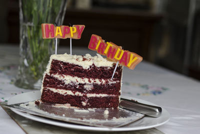 Close-up of cake with ice cream in plate on table