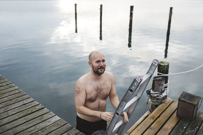 Man leaving lake