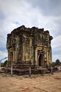 Old ruins of temple against cloudy sky