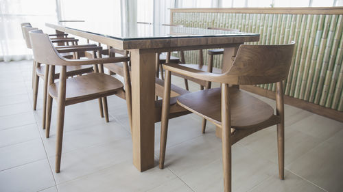 Empty chairs and table in cafe