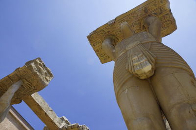 Low angle view of statue against sky