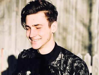 Portrait of smiling young man looking away