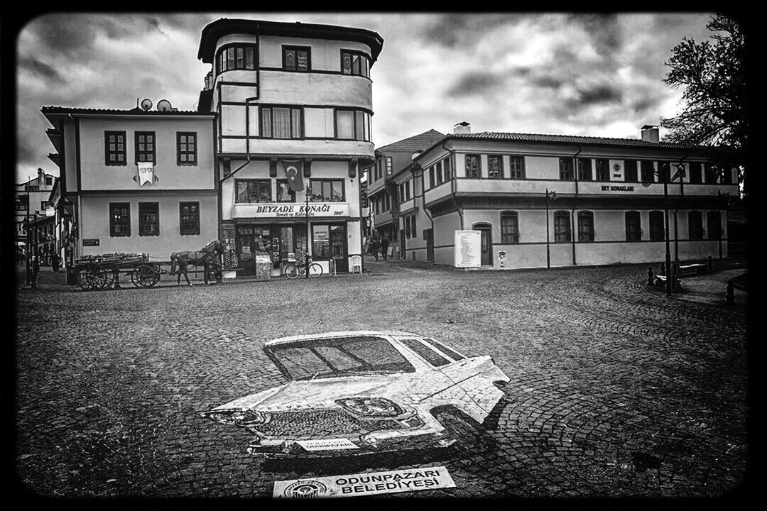 building exterior, architecture, transfer print, built structure, sky, auto post production filter, city, cloud - sky, building, street, residential building, residential structure, cloud, day, window, outdoors, transportation, facade, city life, cloudy