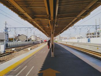 Railroad station platform against sky