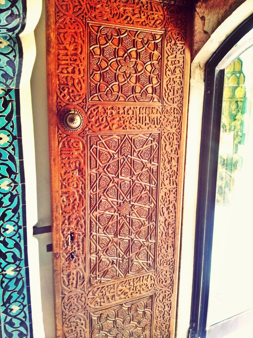 indoors, design, art and craft, pattern, ornate, art, creativity, close-up, door, wood - material, built structure, metal, architecture, wall - building feature, no people, floral pattern, closed, part of, religion, carving - craft product