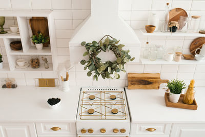 Interior of a stylish cozy modern white wooden kitchen