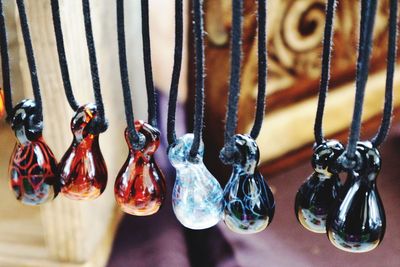 Close-up of necklaces hanging
