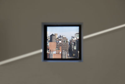 Close-up of cityscape seen through window