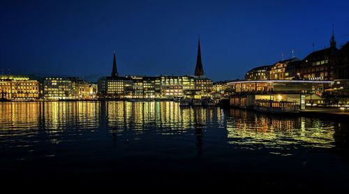 Illuminated buildings at waterfront