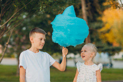 Full length of father and daughter outdoors