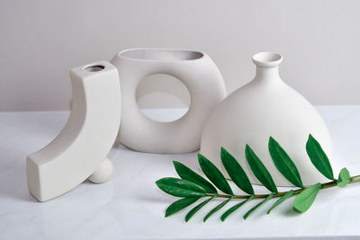 Close-up of white container on table