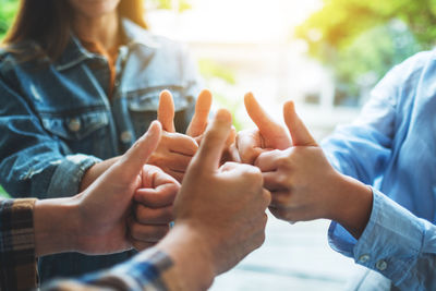 Midsection of man holding hands