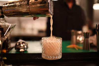 Close-up of beer glass on table