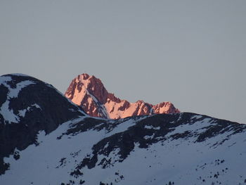 Scenic view of snowcapped mountains against clear sky