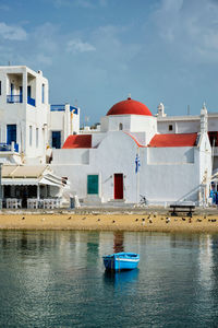 Blue fishing boat in port harbor on mykonos island, greece