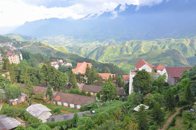 High angle view of townscape and mountains