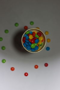 High angle view of multi colored candies on table