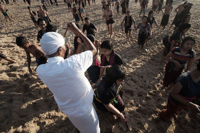 High angle view of people enjoying on land