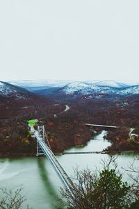 Bridge over river against sky