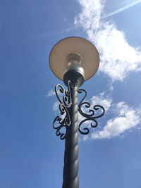 Low angle view of street light against sky