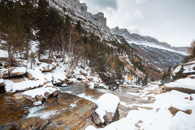 Scenic view of snow covered mountains against sky