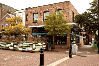 Exterior of building by street against sky