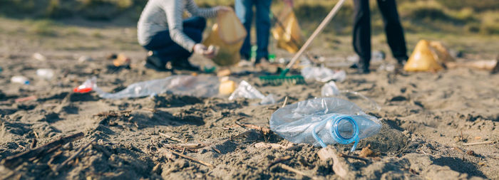 Close-up of plastic bottle on land