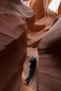 Man photographing at lower antelope canyon