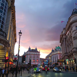 City street and buildings against sky