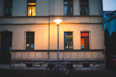 Street light against building at night