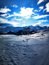Scenic view of snowcapped mountains against sky