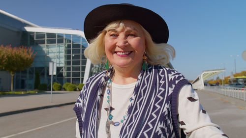 Portrait of a smiling woman in city