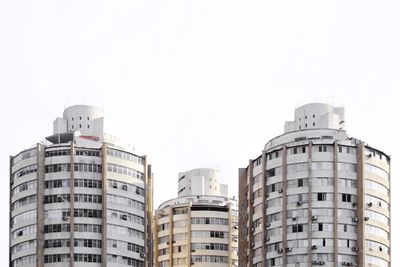 Low angle view of buildings against clear sky