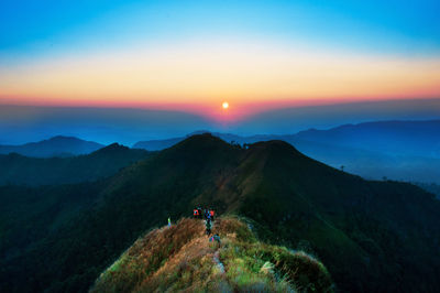 Scenic view of mountains against sky during sunset