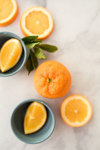 Flatlay of citrus oranges on white