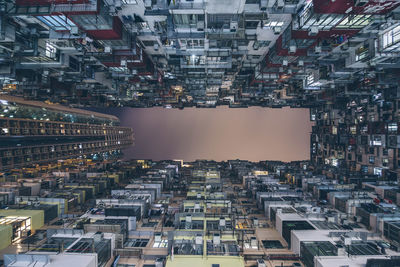 Directly below shot of illuminated buildings at night